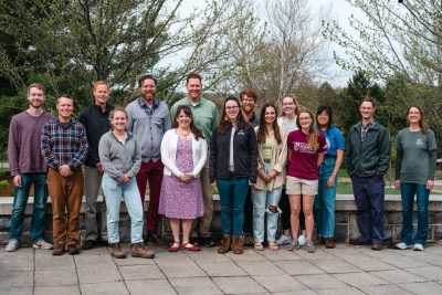Photo of the bee campus committee members smiling before starting the pollinator walking tour at Hahn Garden. 