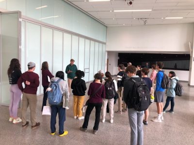 People standing in the large atrium of a building