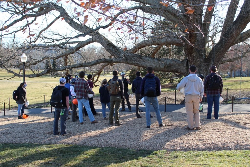Standing next to Virginia Tech’s Alwood Oak, Geoff Manning of Manning Arboriculture talks with students in Associate Professor Eric Wiseman’s Arboriculture Field Skills class about the field of arboriculture and techniques to preserve old trees. Photo by Krista Timney, Virginia Tech.