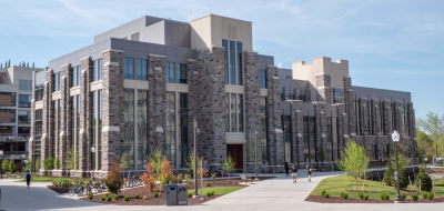 Rendering of exterior of Hitt Hall on the right and a photo of current construction progress on the left