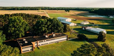 Drone photo from above the Eastern Shore AREC facilities complex with a variety of buildings and small barns