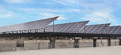solar panels against a blue sky atop the Perry Street 