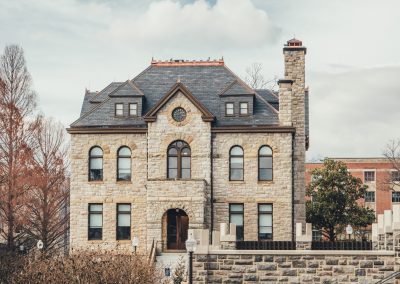 Grey Hokie Stone College of Liberal Arts and Human Sciences building on an autumnal day