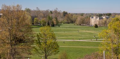 A view of the drillfield from a rooftop with people wandering down below about the size of ants.