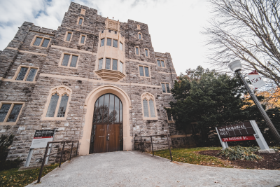 Grey Hokie Stone exterior of War Memorial Hall on an autumnal day